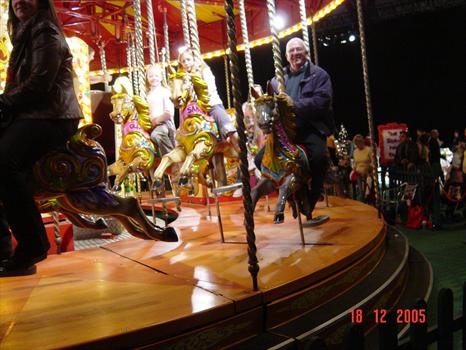 winter 2005 John and grandchildren on Carousel