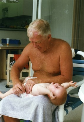 John changing Jessica's nappy - aged 9 months