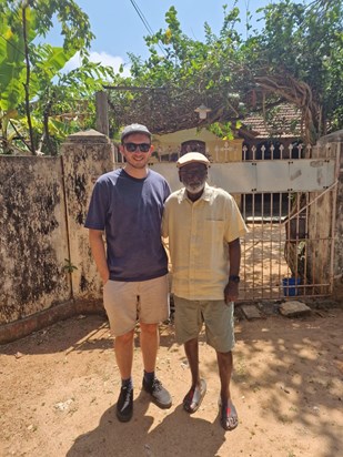 with son-in law Simon in front of his family home - puloly