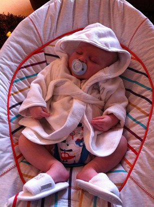 Henry having a nap in his robe and slippers, bought by friend  Shelly. December 2012