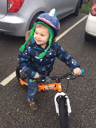 Henry on his new bike he got for Christmas. New Years Day 2016. The only time he got to try it out.