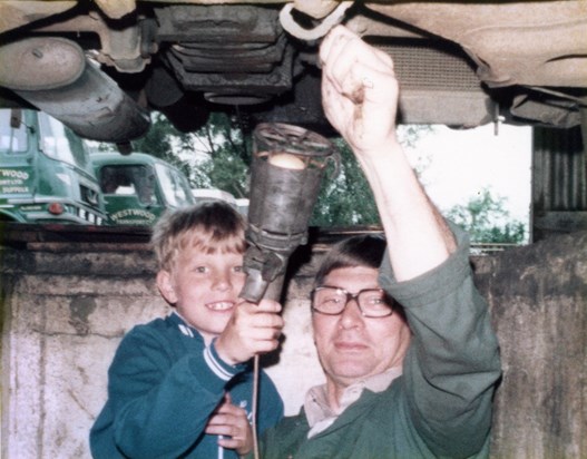 Checking gearbox oil with eager apprentice, 1974