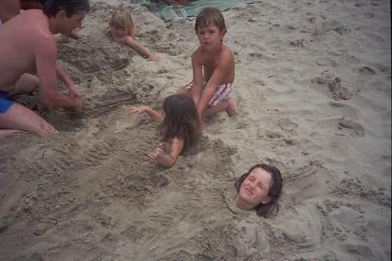 Burying children at the beach, with Megan, Andrew, Laura and Kate