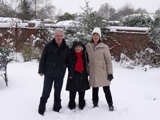 Enjoying the snow in his garden with Norah and Helene