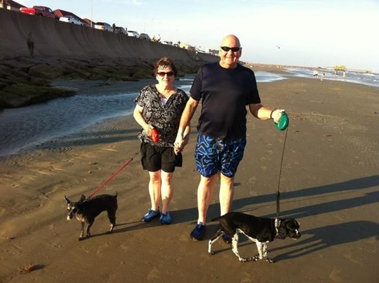 Jeneene and Bud and the dogs at the beach