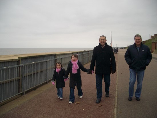 Family walks on Gorleston beach 