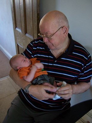 Meeting his grandson Ethan for the first time (Aug-2007)