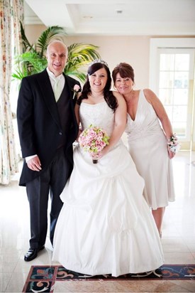 Dad with my mum and I before the wedding.