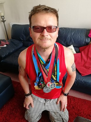 So proud of his medals 