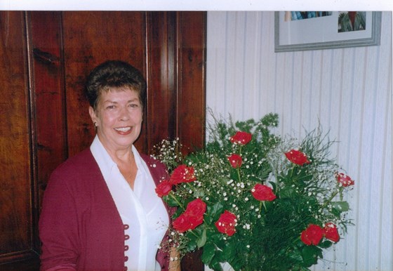 Mum and flowers in the house