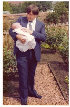 James at nephew's christening 1985