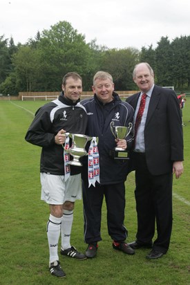 Simon holding the FA County Youth Cup - won in 2010 History Maker