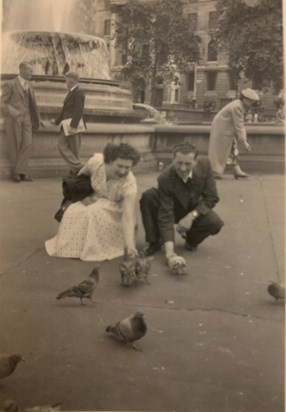 Nanny and Grandad feeding the pigeons in London