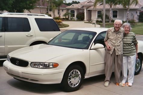 Mom & dad with new car in 2004