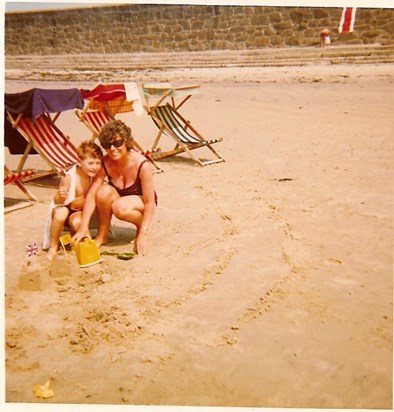 Mum and me (aged 6 or 7) on beach