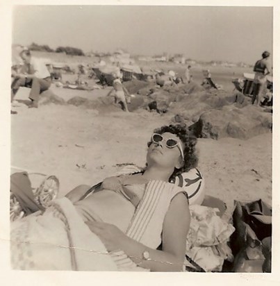 Mum sunbathing on beach