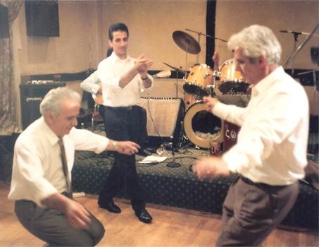 Michael admiring Dad and Theo Daki dancing July 1992