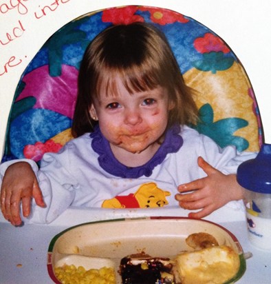 That little face is still beautiful with all that food and a black eye!! :)