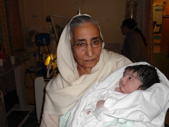 Bibi holding baby Avraj for the first time!