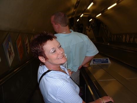 smiling on the underground escalator London