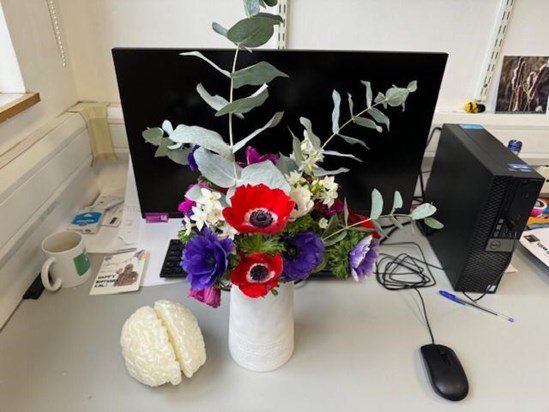 Flowers for Cal on their desk in the lab. 