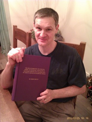 With his PhD thesis