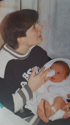 Holding her new nephew. 1992