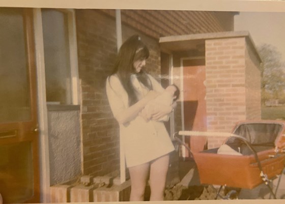 Maureen with her baby brother Richard in one of her very mini dresses!