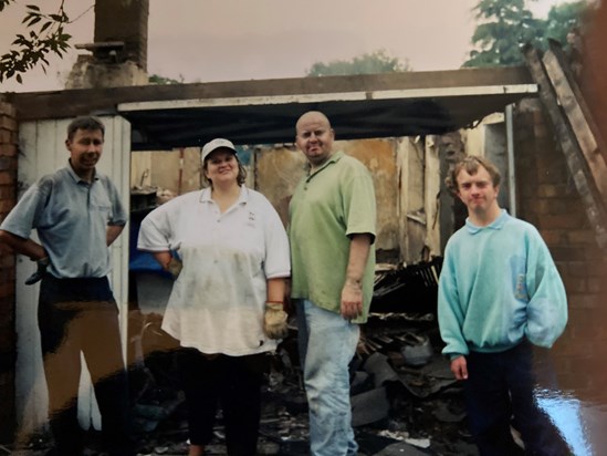 Richard helping us knock down the old garage, a very messy job