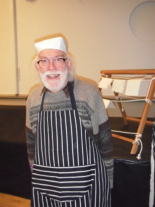 Alan wearing his paper hat while demonstrating paper making, 2015