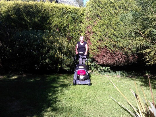 Looking really pleased with her new lawn mower