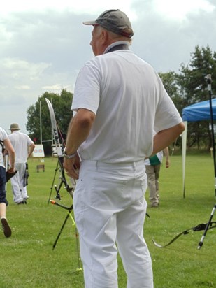 The stance of a much loved archery coach, Mr Harry Heeley.