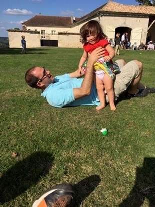 Rhodri playing with his little girl at Matthew and Sara's wedding