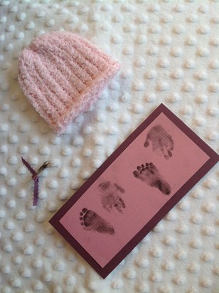 Amelie's hand & footprints, lock of hair and little hat 