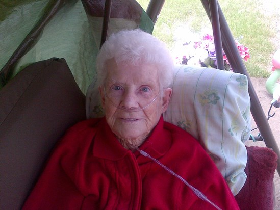 Content on her garden swing