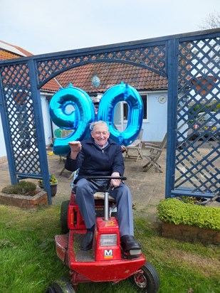 01-01-2015 123 Dennis enjoying his birthday treat last year, a ride on the mower and cutting the grass, he didn't know I was stood behind him with the numbers!!!!