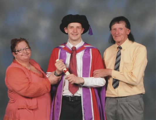 Liz (mum) with me and dad at my graduation in 2016.