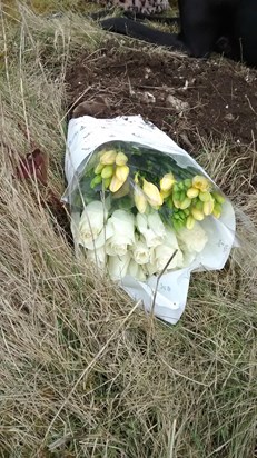 Alan we left your favourite flowers white roses and yellow freesias x with love