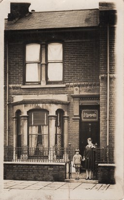 Joan as a child outside her home in Portsmouth