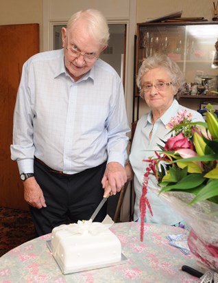 Mum and Dad cut their cake at their diamond wedding anniversary in September 2014