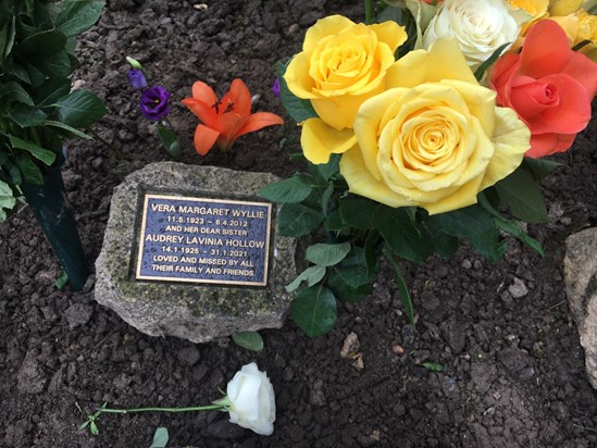 Laying flowers at Vera & Audrey’s Memorial Stone at The Garden’s of Remembrance at Surrey & Sussex Crematorium 