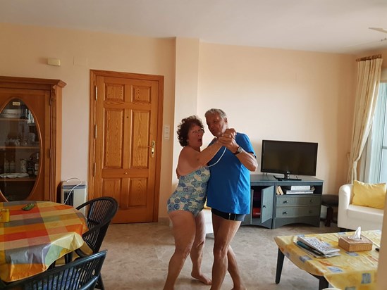 Mike takes Pat for a dance to celebrate the sale of their Spanish apartment