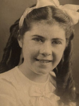 IMG 1478.  My mum when she was a girl. Those curls! 