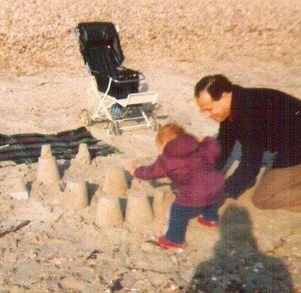 Sandcastles with his son. . .