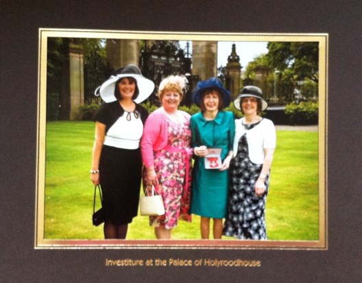 Margeret  receiving her MBE in July 2011 for her fund raising with Shona, Ann and Maureen.