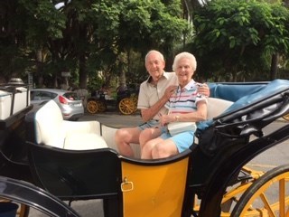 Mum and Dad in carriage on holiday