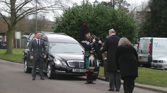 Nadine and the funeral director bow their respects