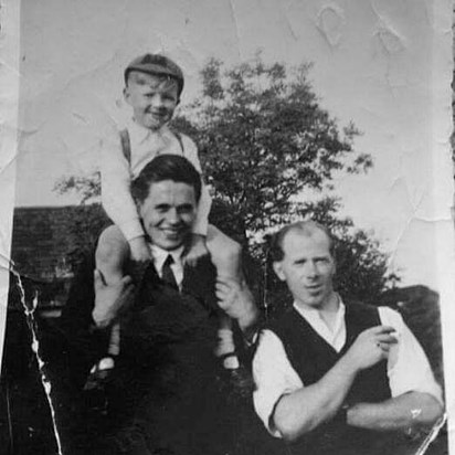 Dad with nephew Michael on his shoulders and Uncle Ted next to him