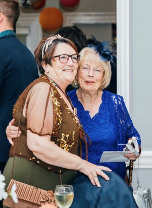 Grannie and Grandma. Both sides of the family united. 