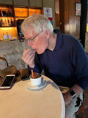 Simon tucking into some chocolate ice cream on his travels